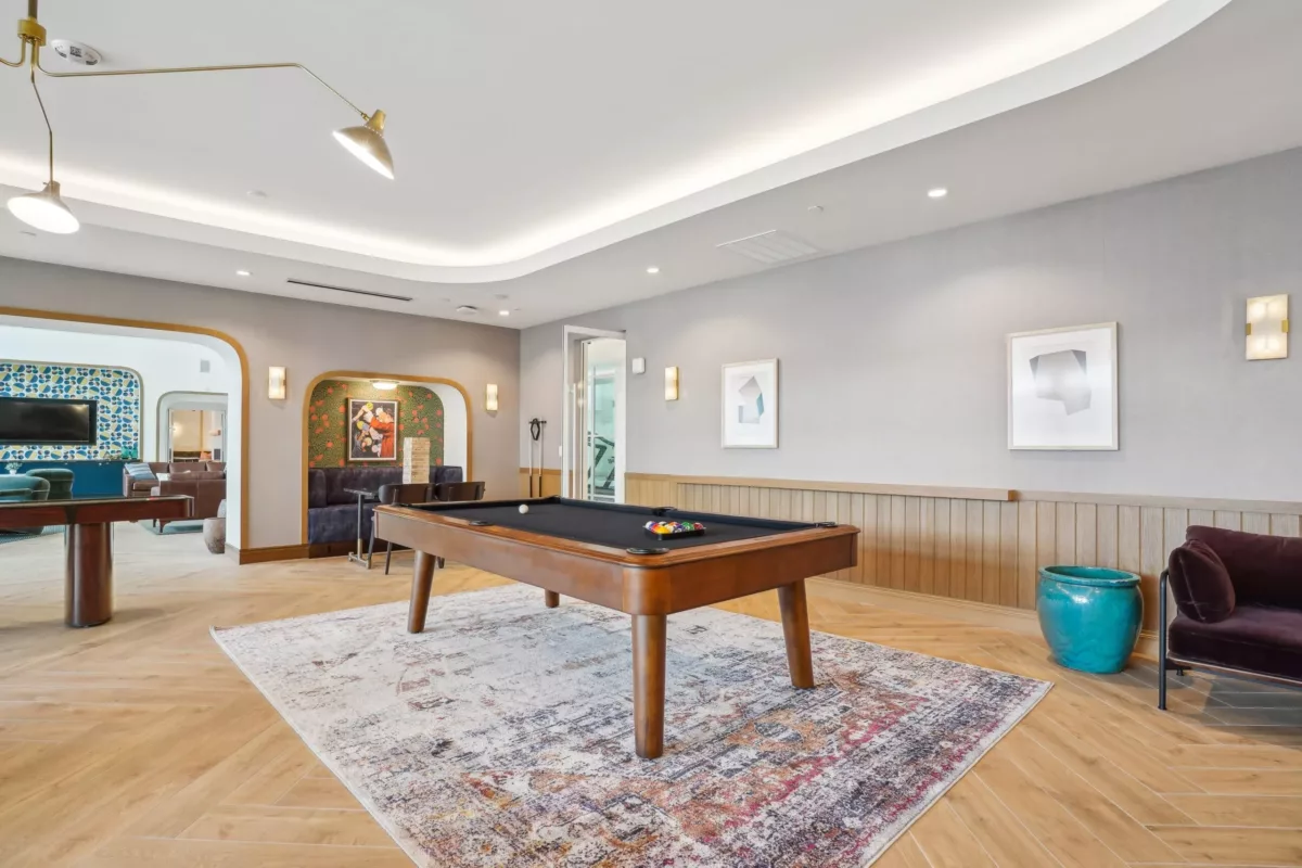 Game lounge with pool table and booths for seating