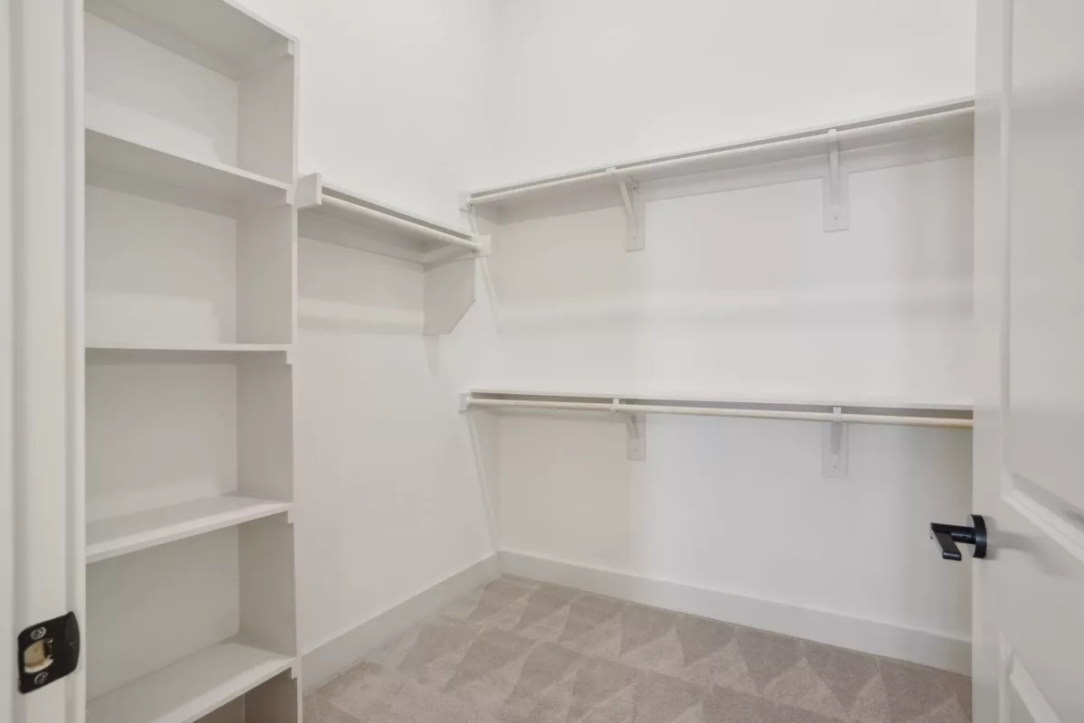 Large closet with built-in shelving and wire shelves.