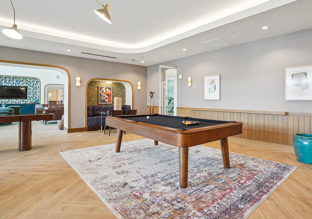 Game lounge with pool table and booths for seating